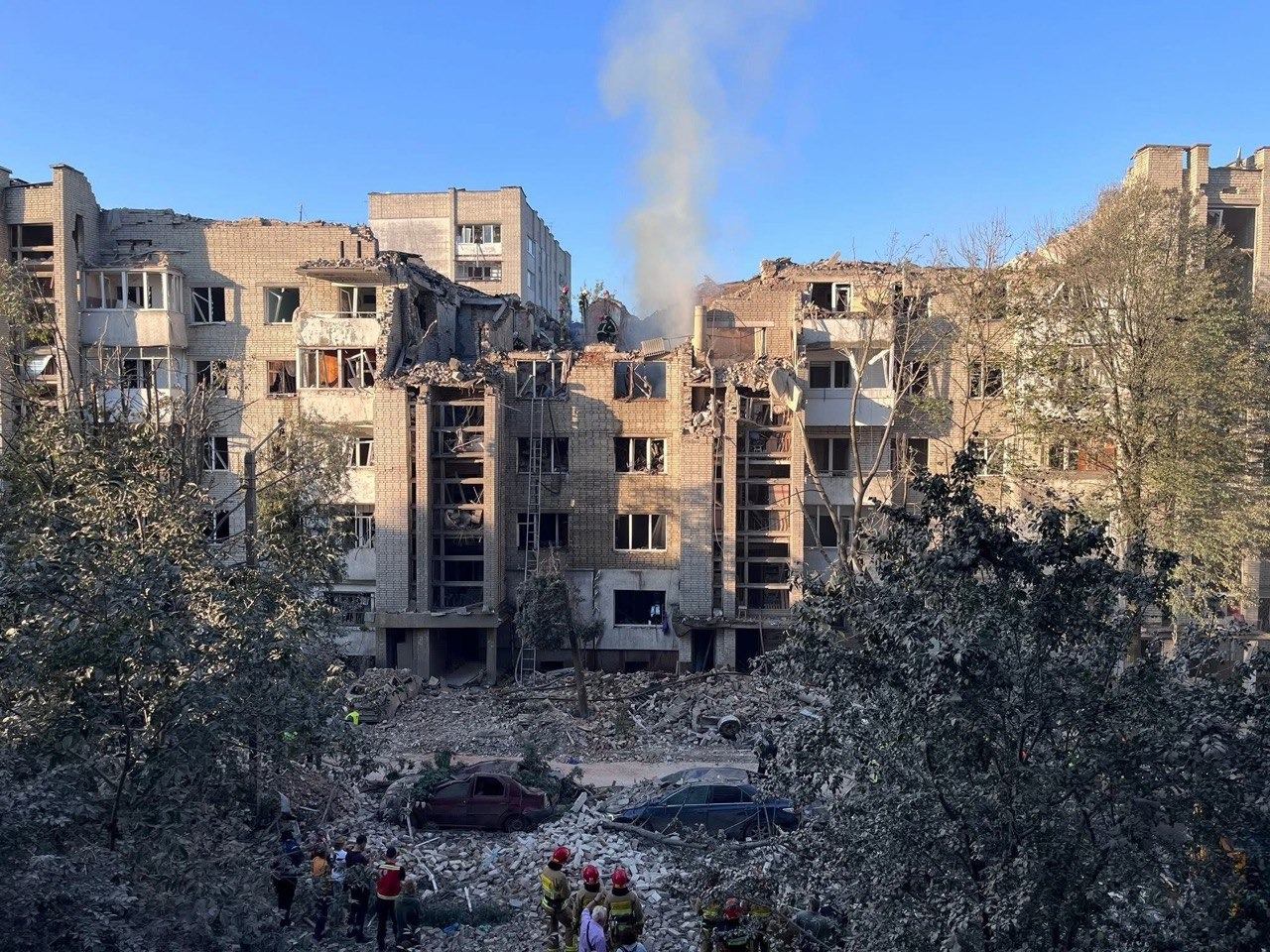 Rescue workers search the rubble of a residential building in Ukraine destroyed by an overnight ballistic missile attack.